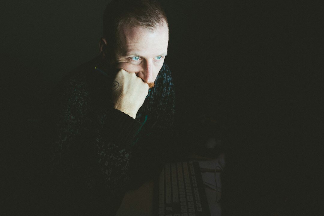 person looking worried at laptop