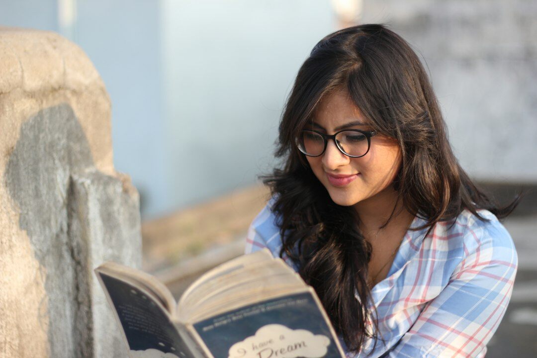 woman reading research paper